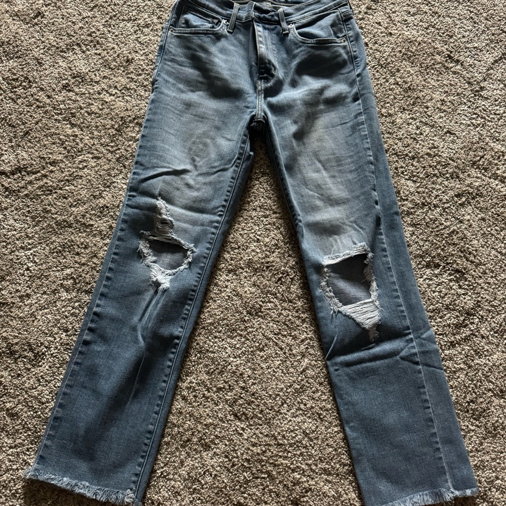 Levi’s cropped fringe light wash jeans